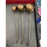 A GROUP OF THREE VINTAGE BRASS AND COPPER SPIRIT TODDY LADLES - WHISKY, RUM AND BRANDY