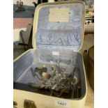 A VINTAGE VANITY CASE WITH A QUANTITY OF FLATWARE, SCISSORS, ETC