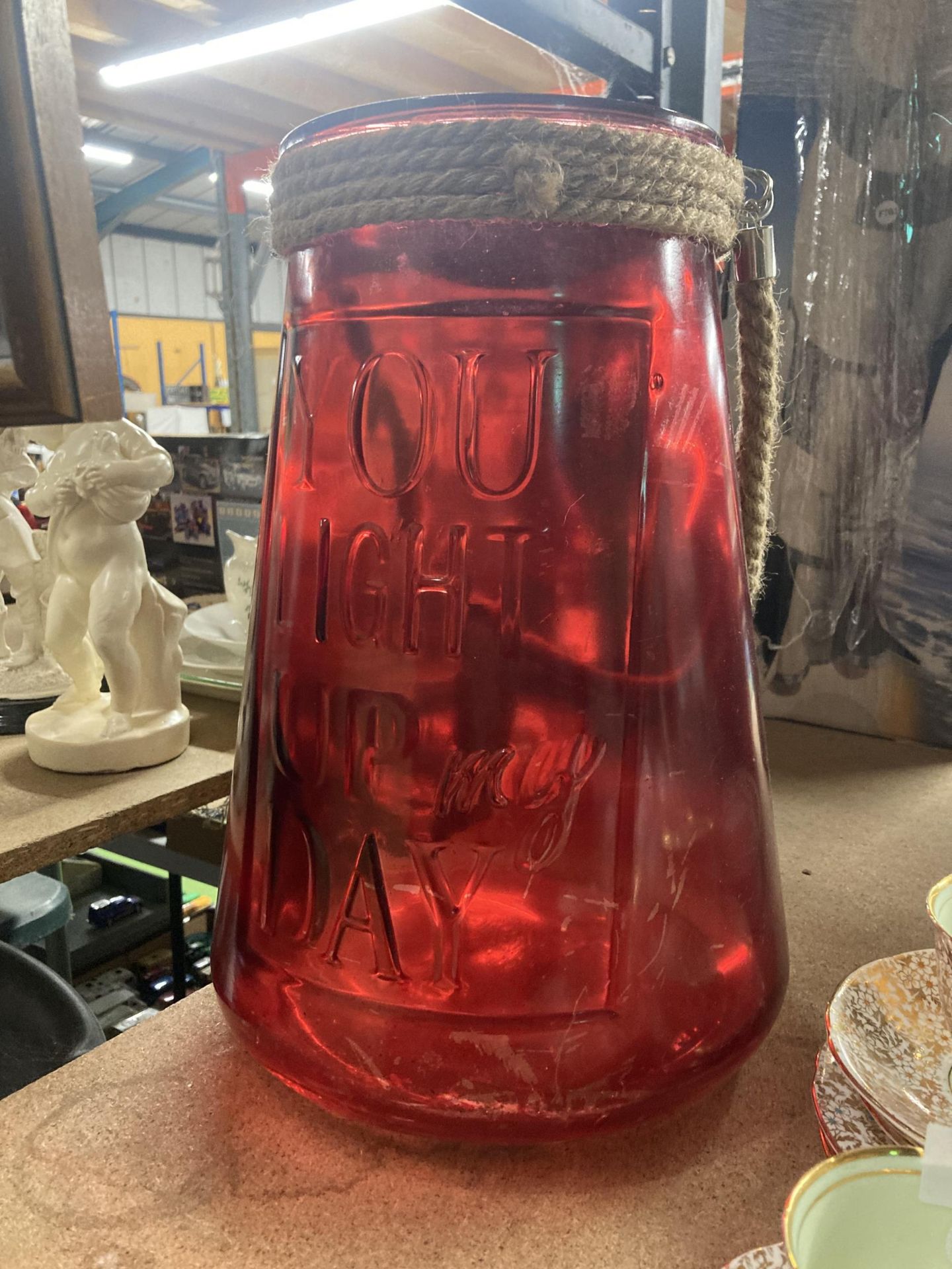 A LARGE RED GLASS YOU LIGHT UP MY DAY URN