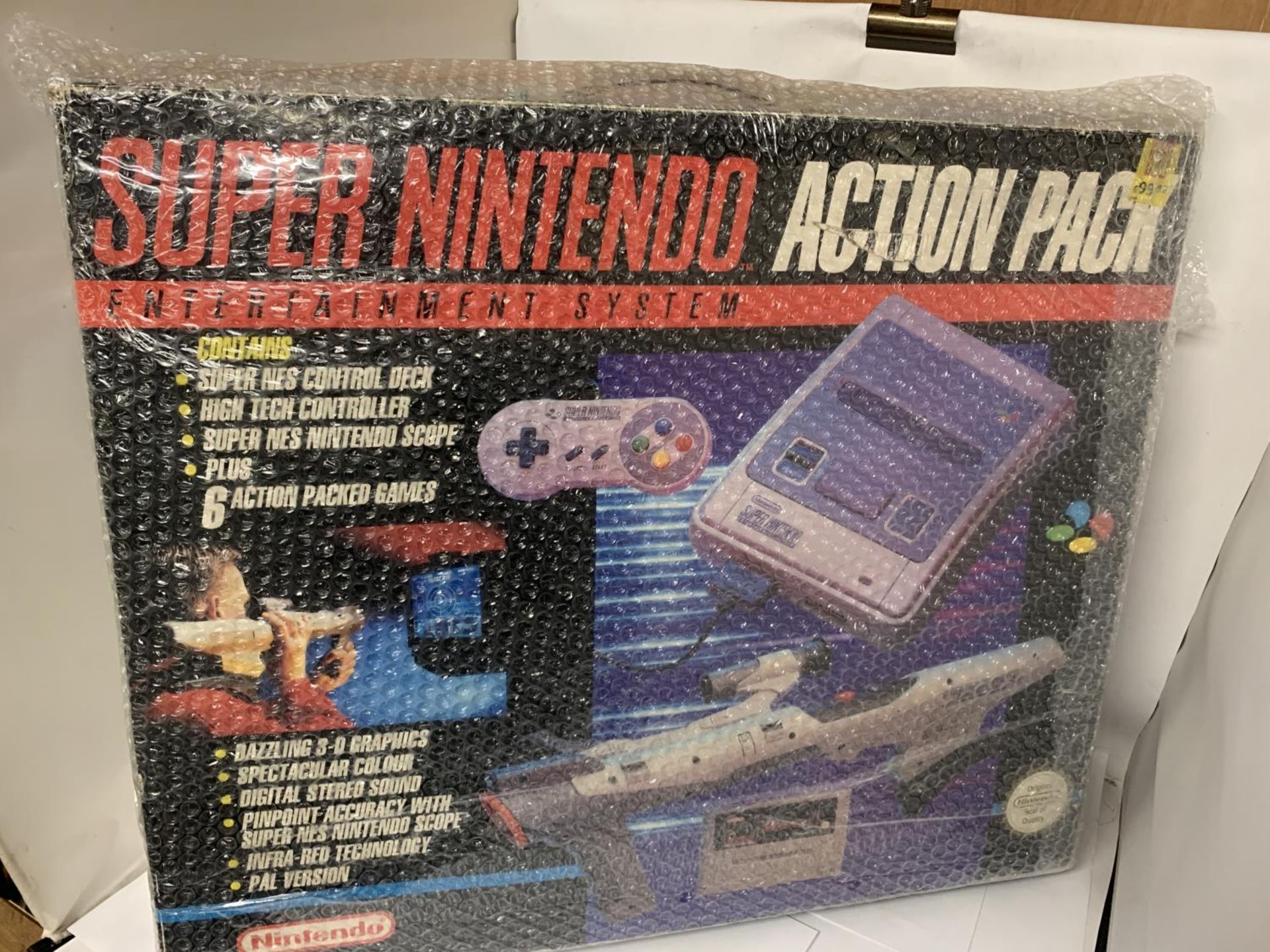 A BOXED SUPER NINTENDO ACTION PACK ENTERTAINMENT SYSTEM