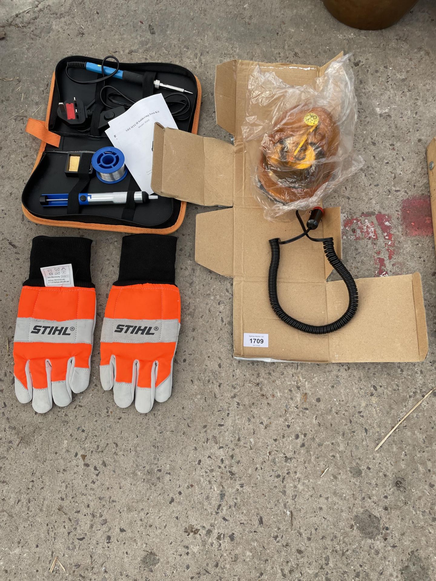 AN ASSORTMENT OF ITEMS TO INCLUDE STIHL CHAINSAW GLOVES, A SOLDERING KIT AND A FLASH LIGHT ETC