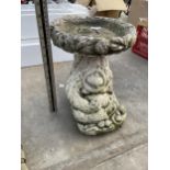 AN ORANGUTAN DESIGN CONCRETE BIRD BATH