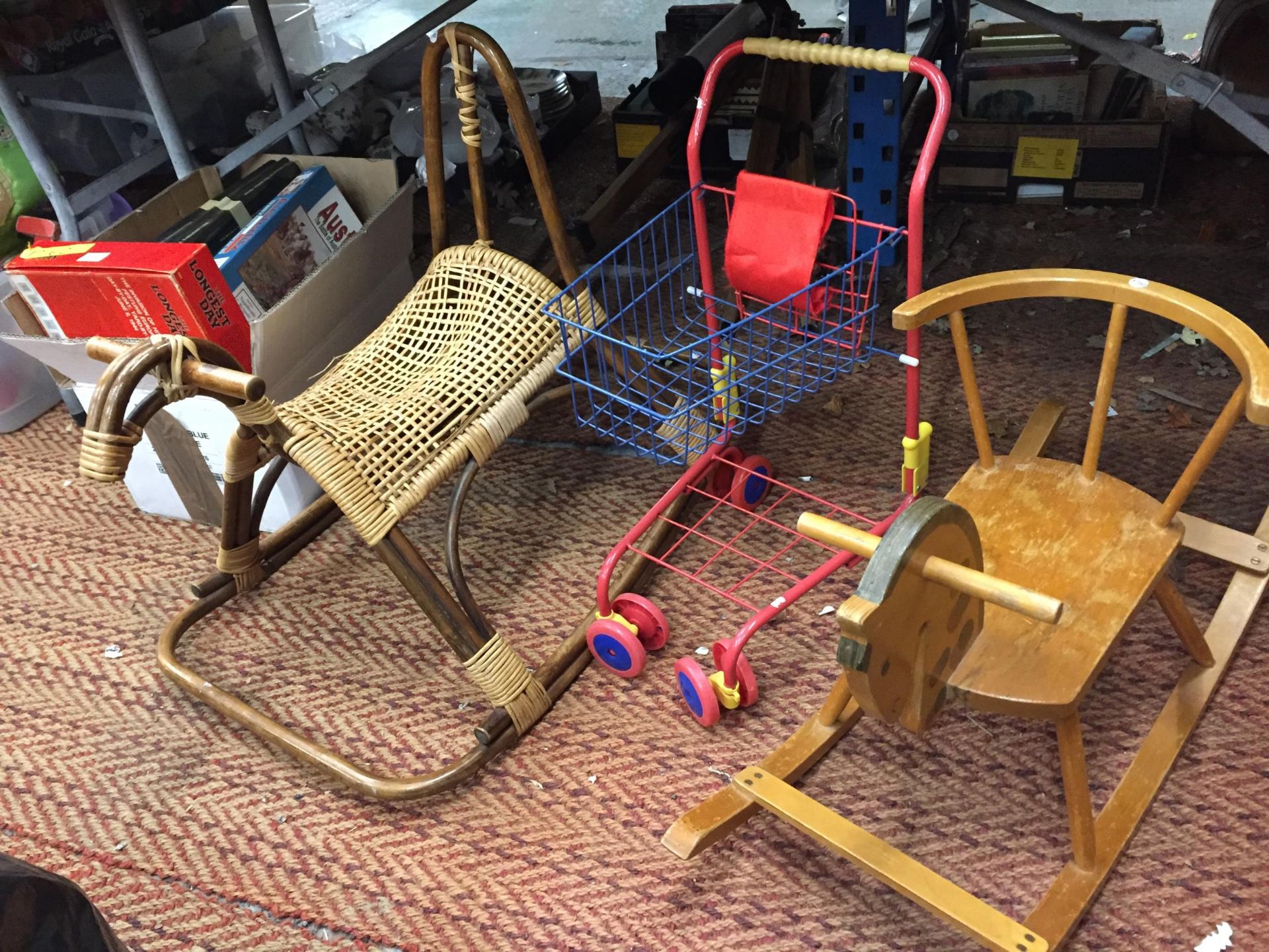 A VINTAGE WOODEN CHILD'S HORSE ROCKER, A WICKER HORSE ROCKER PLUS A CHILD'S SHOPPING TROLLEY