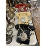 THREE VINTAGE ROTARY DIAL TELEPHONES IN BLACK, CREAM AND RED