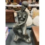 AN ABSTRACT DESIGN BRONZE EFFECT NUDE STATUE