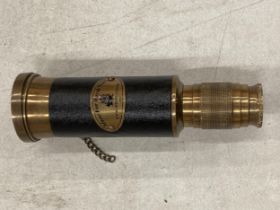 A BRASS AND LEATHER ROYAL NAVY TELESCOPE
