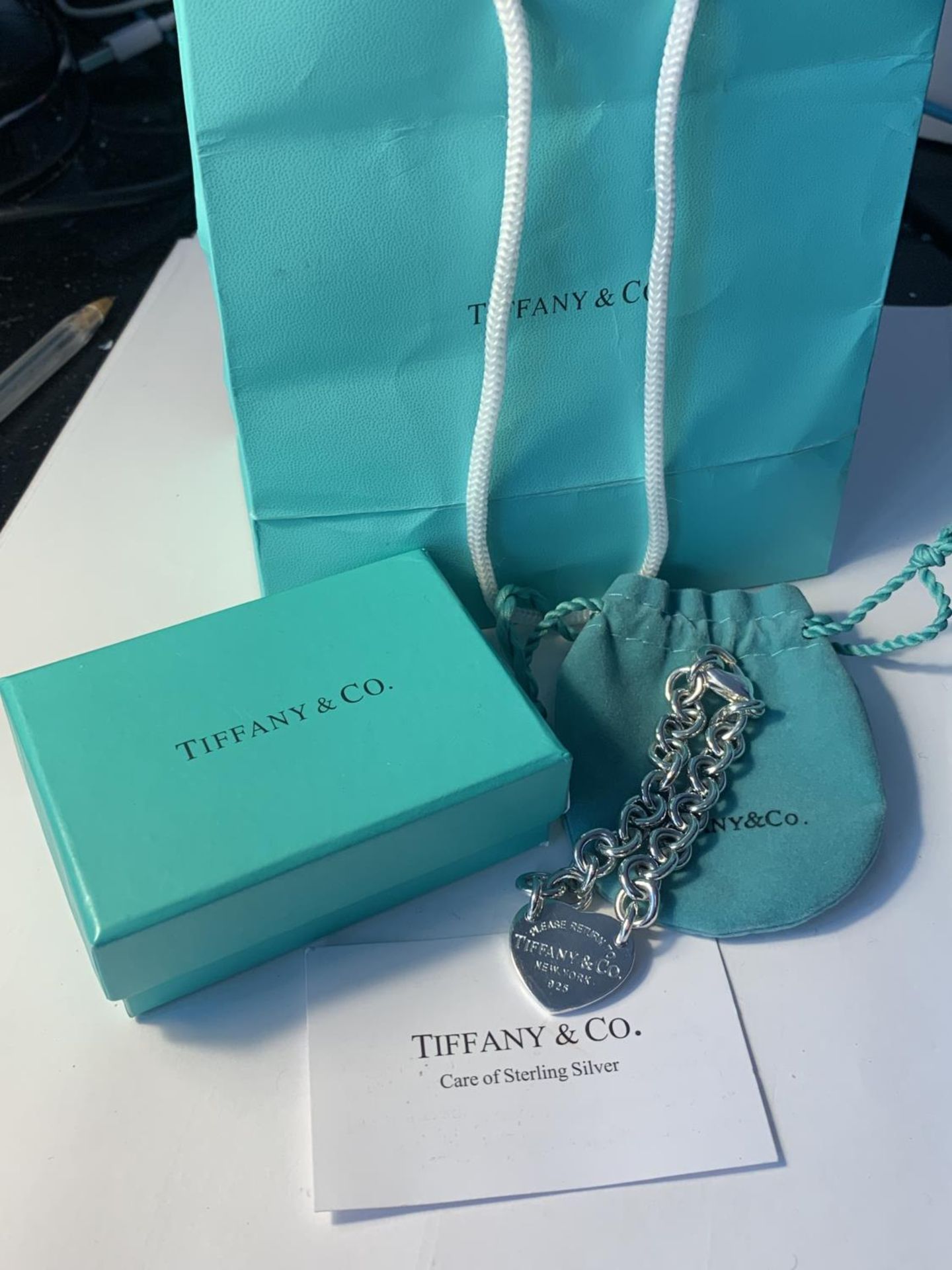 A TIFFANY BRACELET WITH SOFT BAG, PRESENTATION BOX, PAPER BAG AND CARD