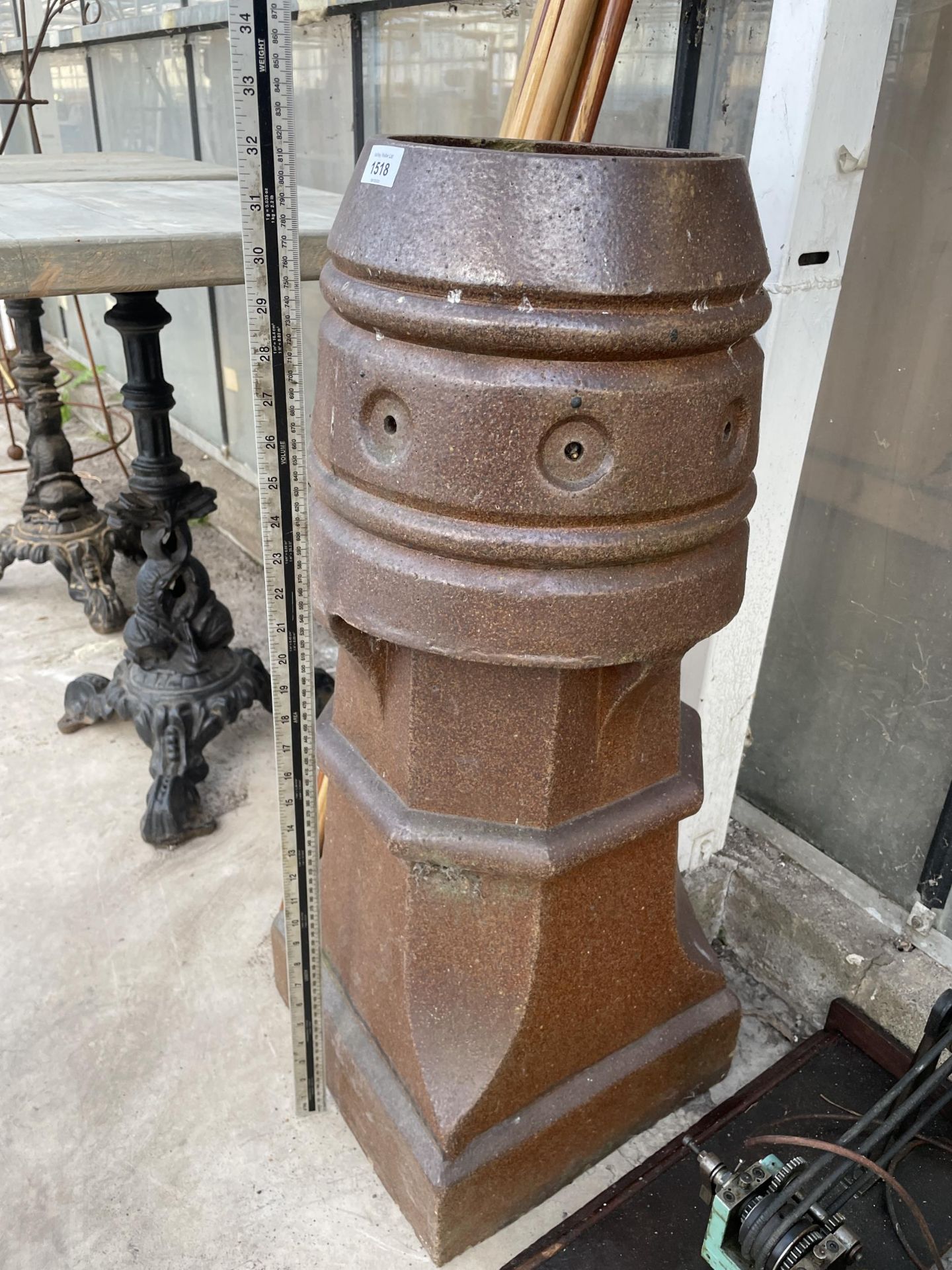 A DECORATIVE SALT GLAZED CHIMNEY POT