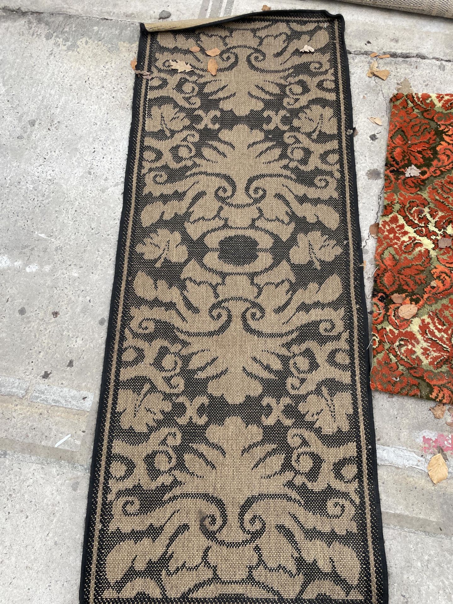 A SMALL BLACK PATTERNED RUG