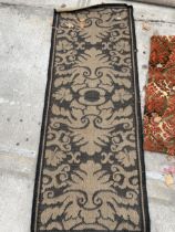 A SMALL BLACK PATTERNED RUG
