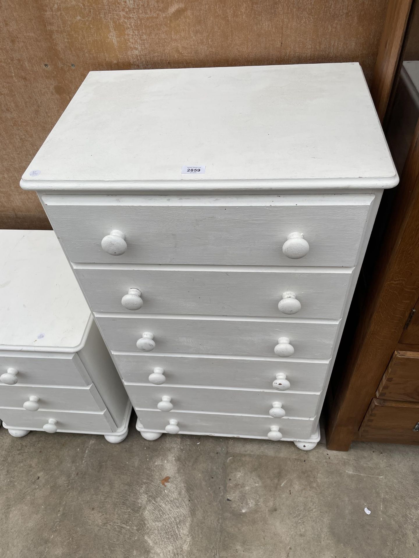 A PAINTED WHITE CHEST OF FIVE DRAWERS