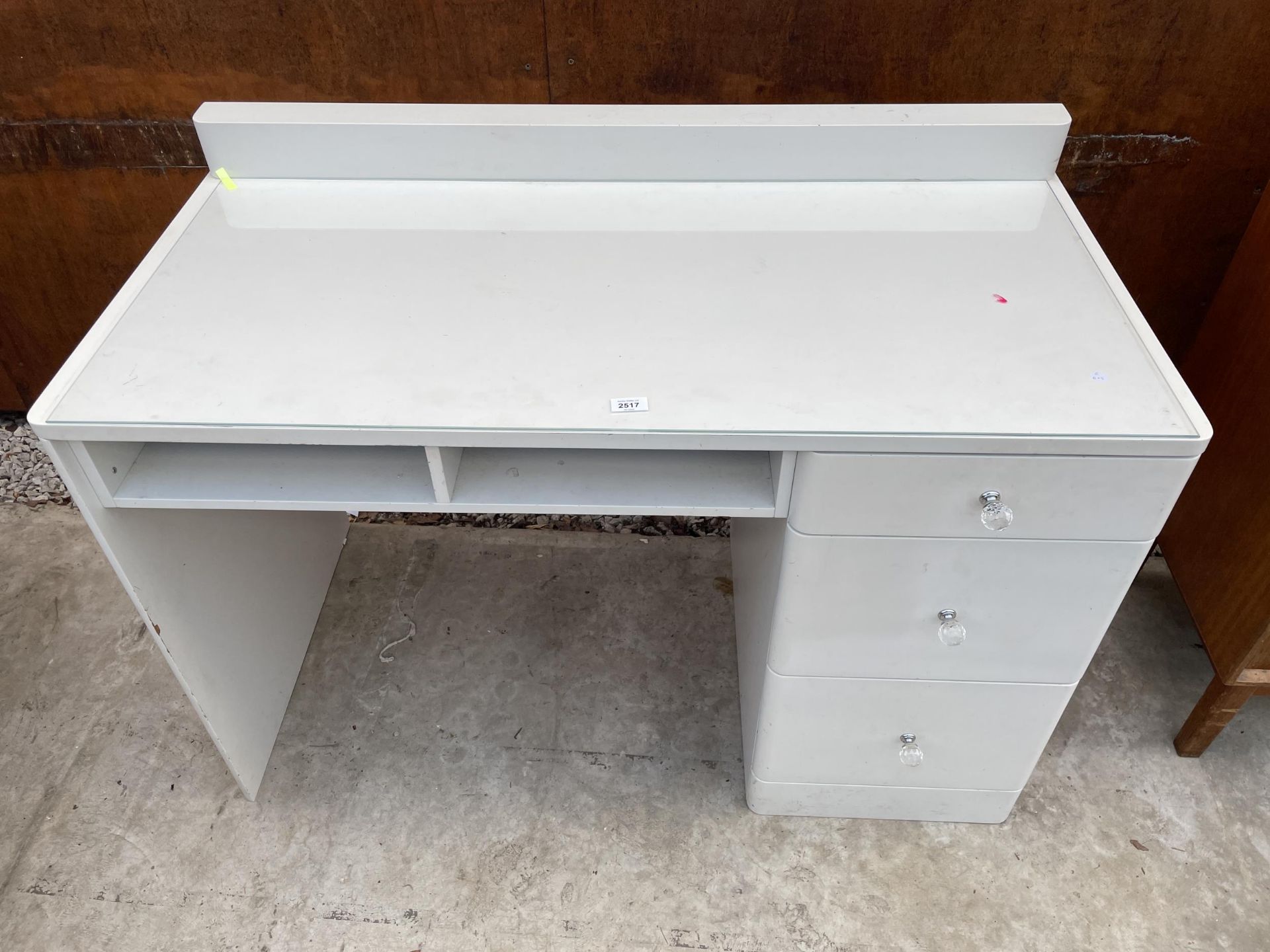 A MODERN WHITE SINGLE PEDESTAL DRESSING TABLE, WITH GLASS KNOBS, 47" WIDE