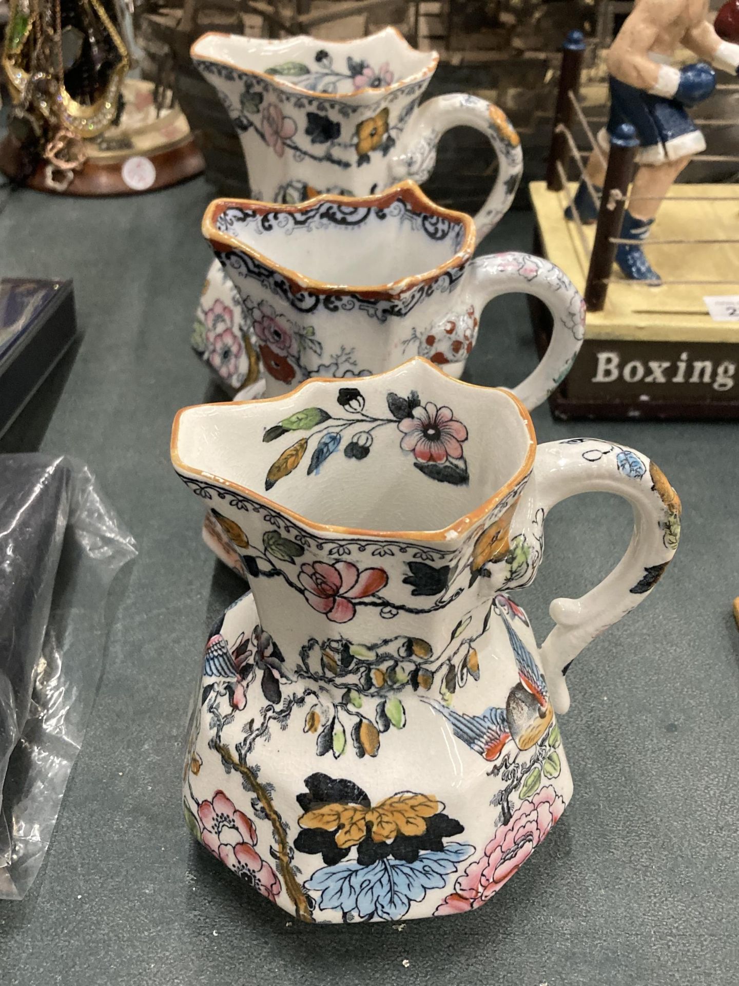 A SET OF THREE MASONS IRONSTONE HYDRA JUGS