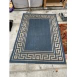 A MODERN BLUE PATTERNED RUG