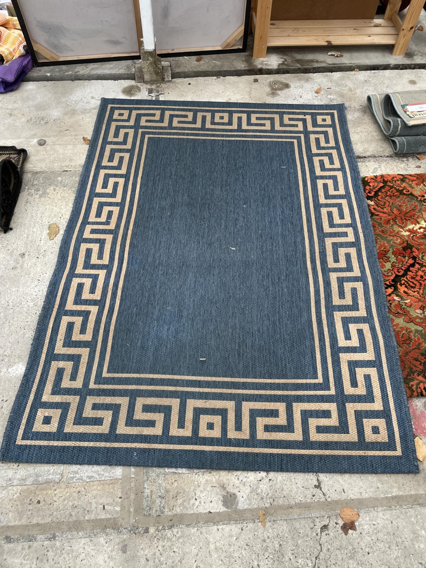 A MODERN BLUE PATTERNED RUG