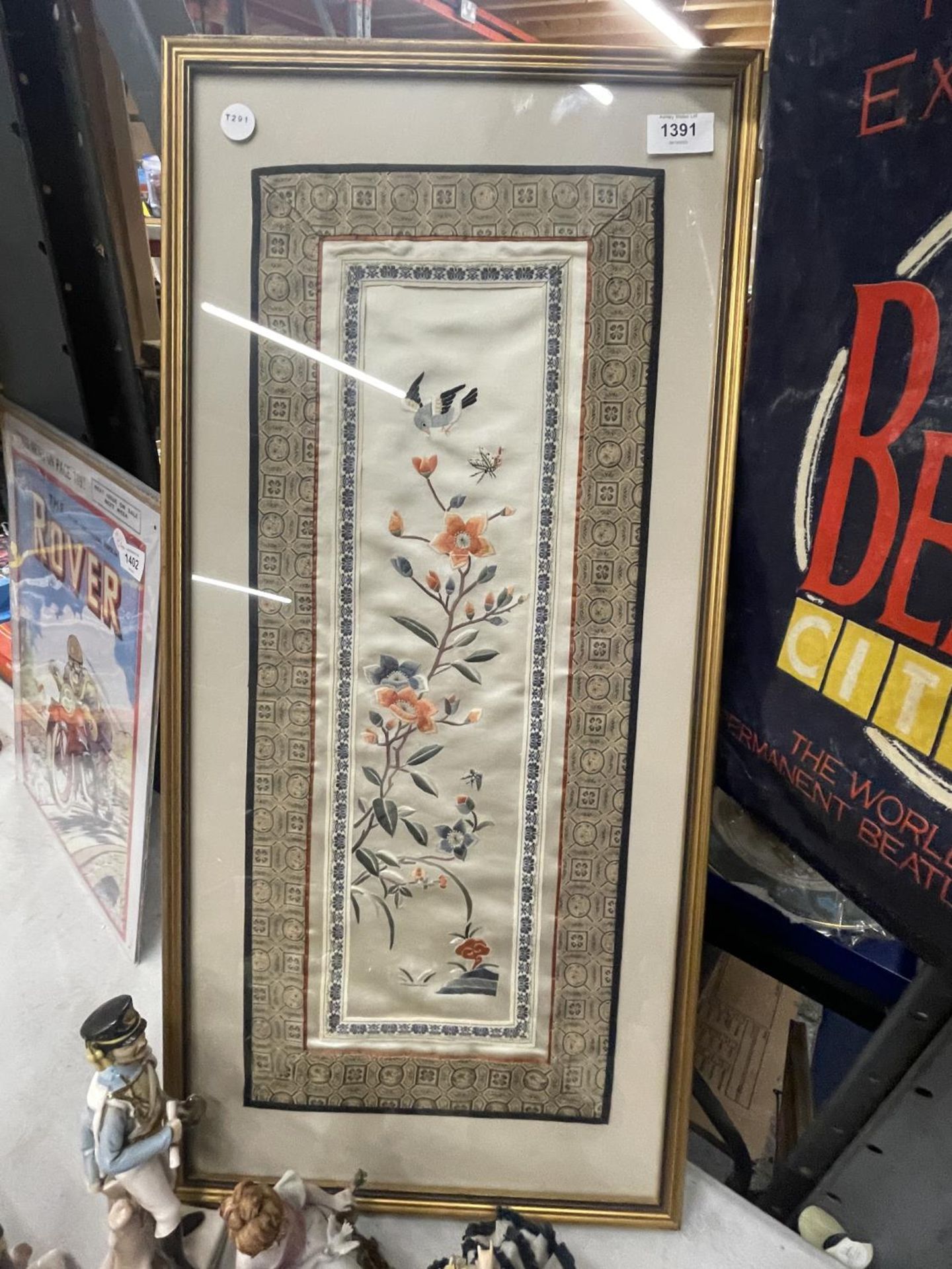 A FRAMED ORIENTAL NEEDLEWORK ON SILK PANEL