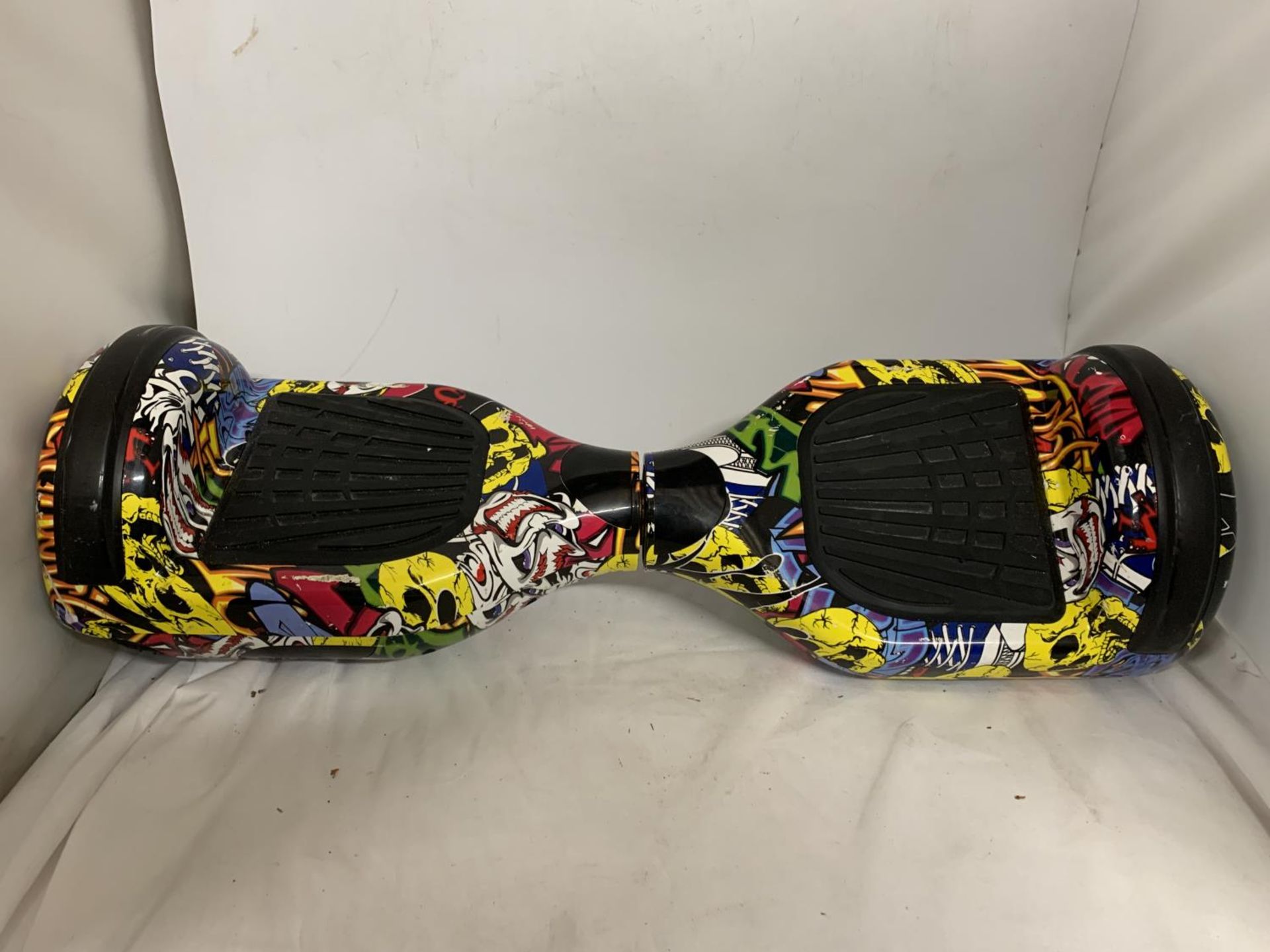 AN ELECTRIC HOVERBOARD WITH SKULL DESIGN