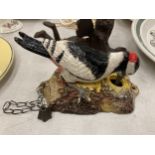 A PAINTED CAST METAL WOODPECKER DOOR BELL