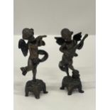 A PAIR OF BRONZE CHERUBS ONE PLAYING A LUTE AND ONE A FLUTE APPROXIMATELY 6 INCHES TALL