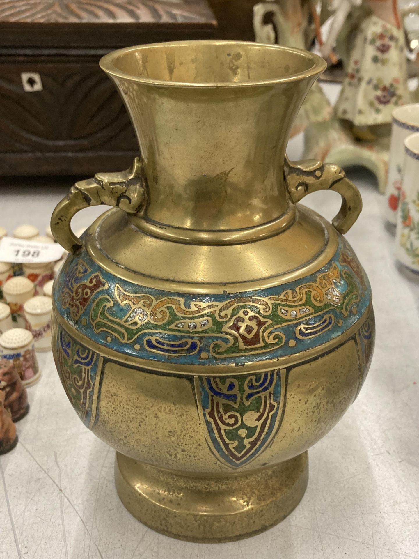 AN ORIENTAL BRASS AND CLOISONNE DESIGN TWIN HANDLED VASE