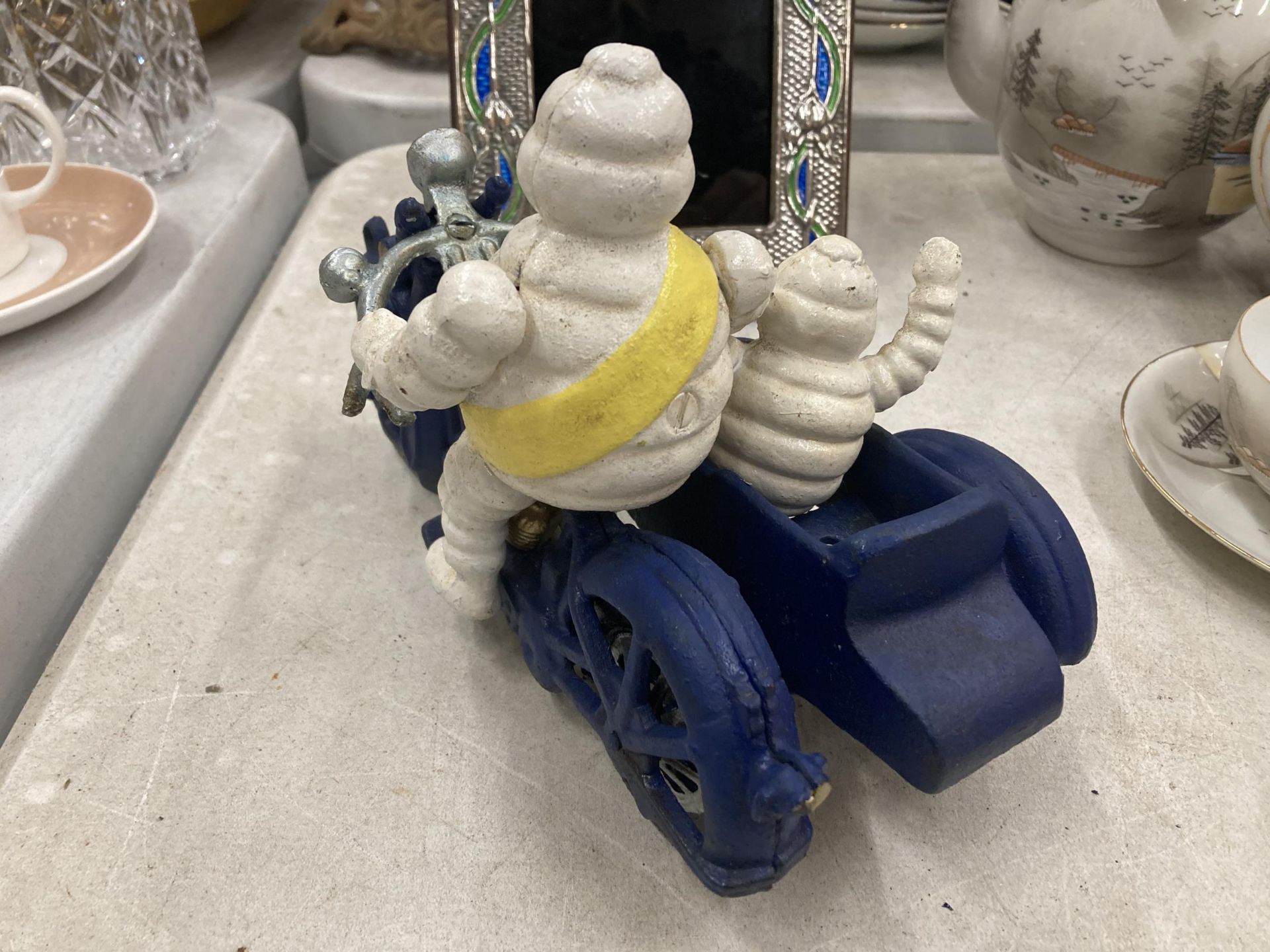 A CAST METAL MICHELIN MAN ON MOTORBIKE FIGURE - Image 3 of 5