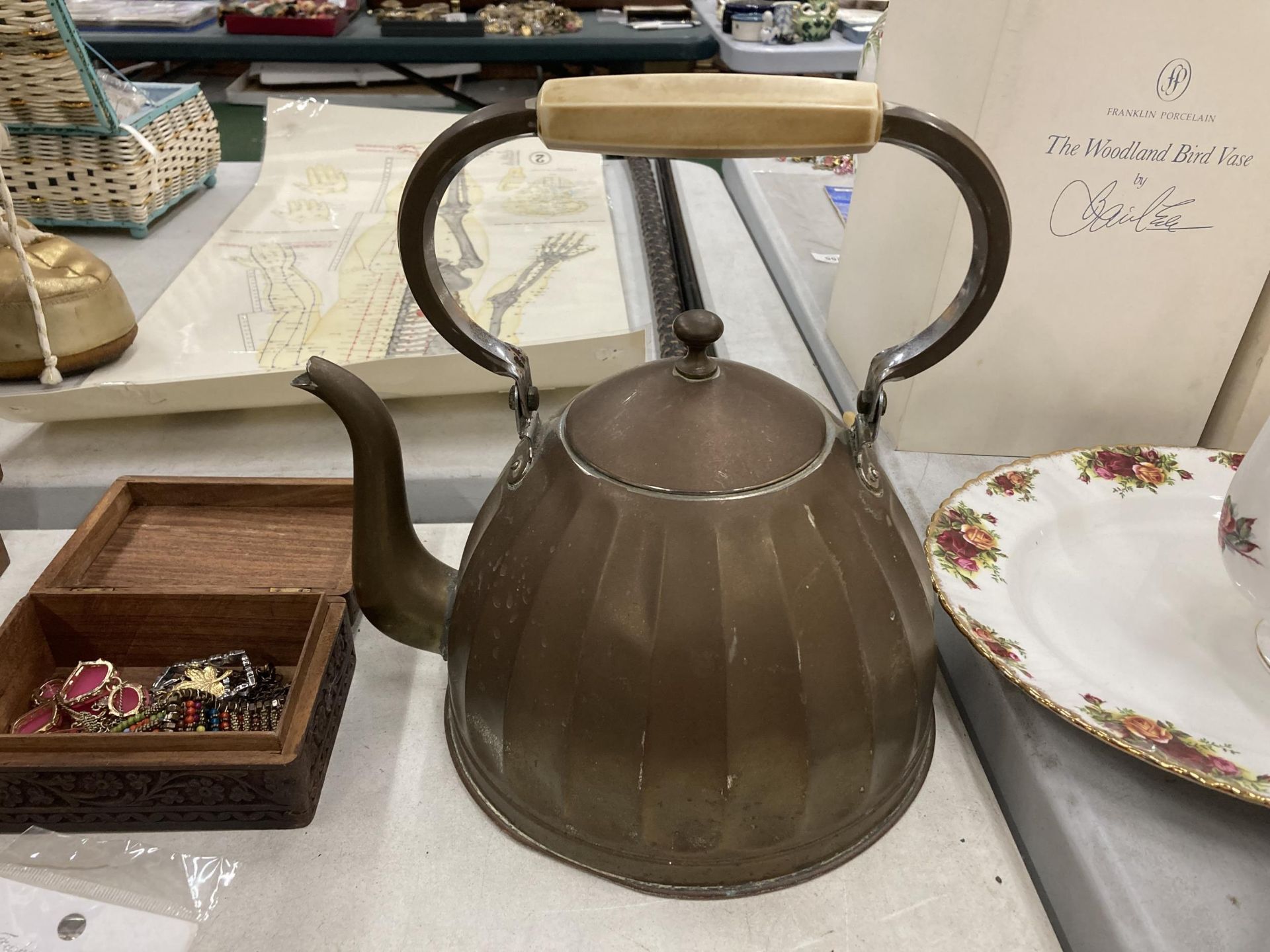 A VINTAGE OVERSIZED BRASS KETTLE