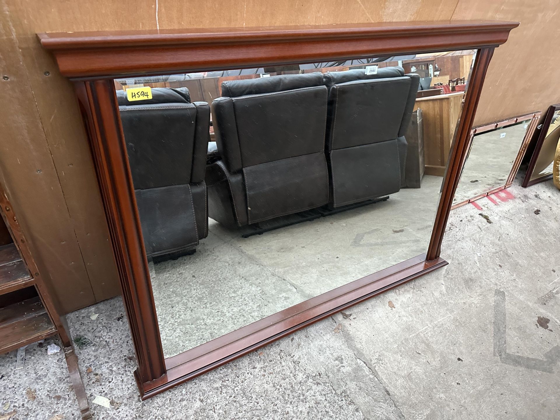 A LARGE MAHOGANY FRAMED MIRROR