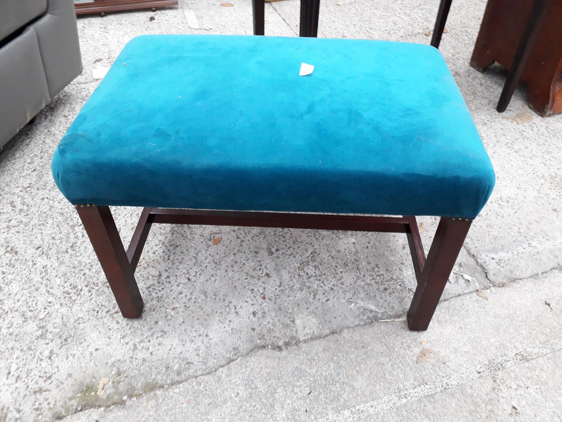 A MODERN UPHOLSTERED STOOL ON MAHOGANY FRAME