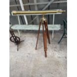 A VINTAGE BRASS TELESCOPE WITH WOODEN TRIPOD STAND