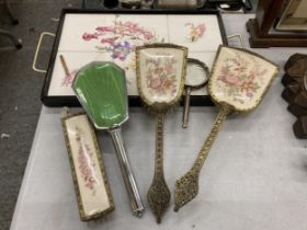 A GROUP OF EMBROIDERED DRESSING TABLE ITEMS AND TILE DESIGN TRAY