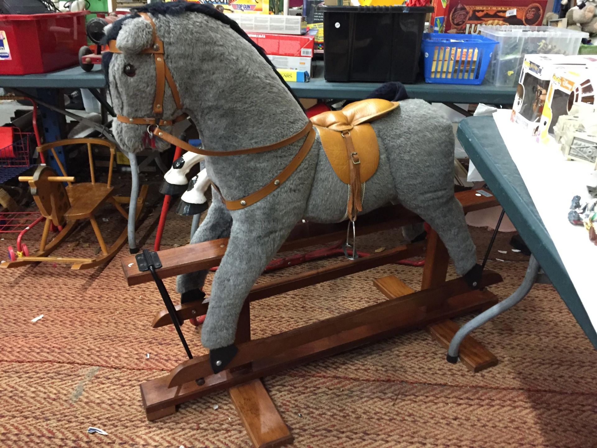 A VINTAGE PEGASUS GREY COLOURED ROCKING HORSE, IN GOOD CONDITION