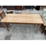 A PINE KITCHEN TABLE ON TURNED LEGS, 72 X 31"