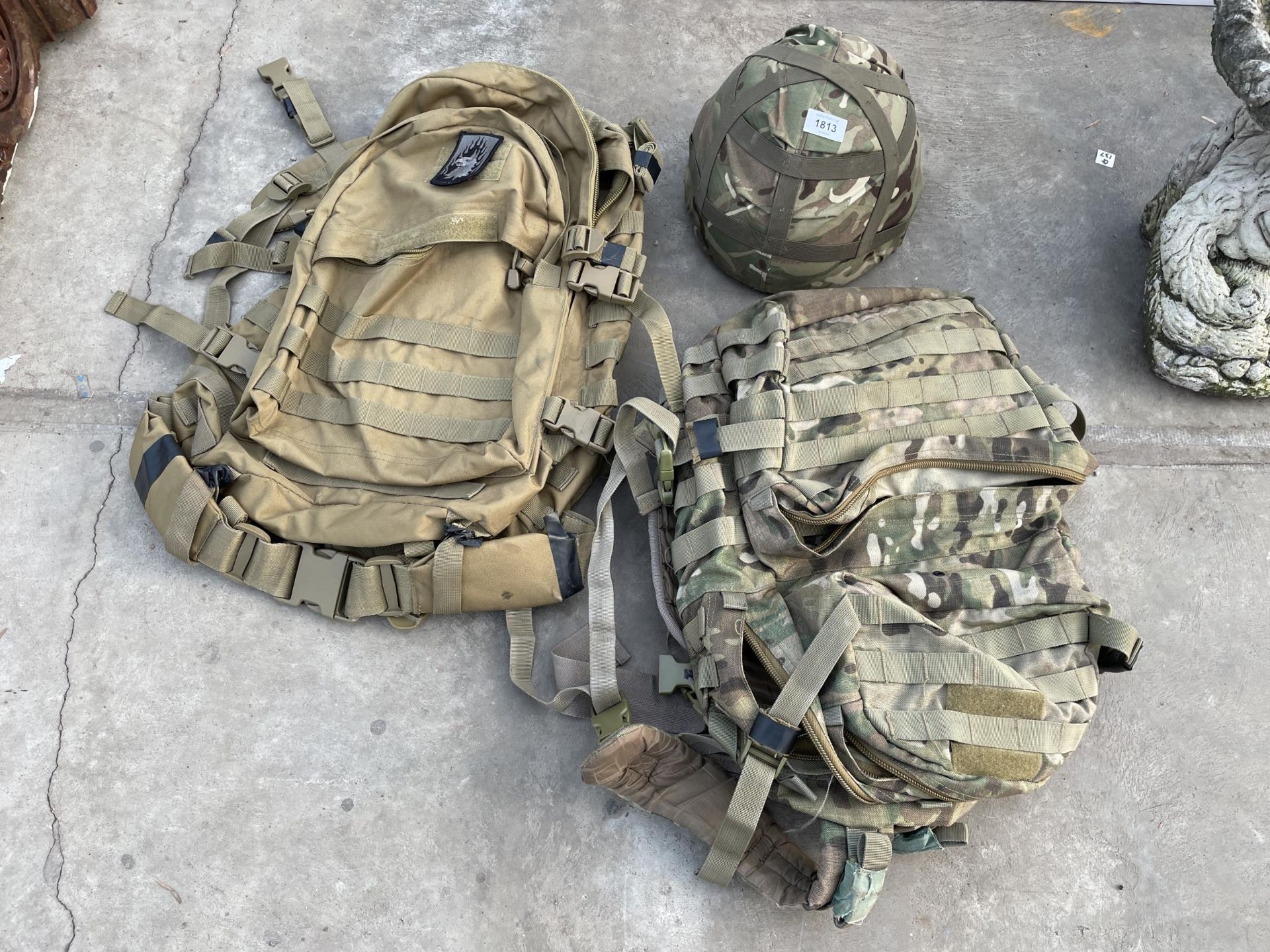 TWO CAMMO BAGS AND A CAMMO HELMET