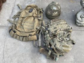 TWO CAMMO BAGS AND A CAMMO HELMET