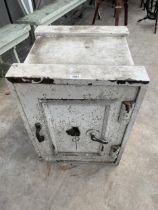 A VINTAGE HEAVY DUTY CAST IRON SAFE COMPLETE WITH TWO KEYS