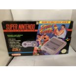 A SUPER NINTENDO ENTERTAINMENT SYSTEM INCLUDING THE WORLD'S GREATEST ARCADE HIT STREET FIGHTER II