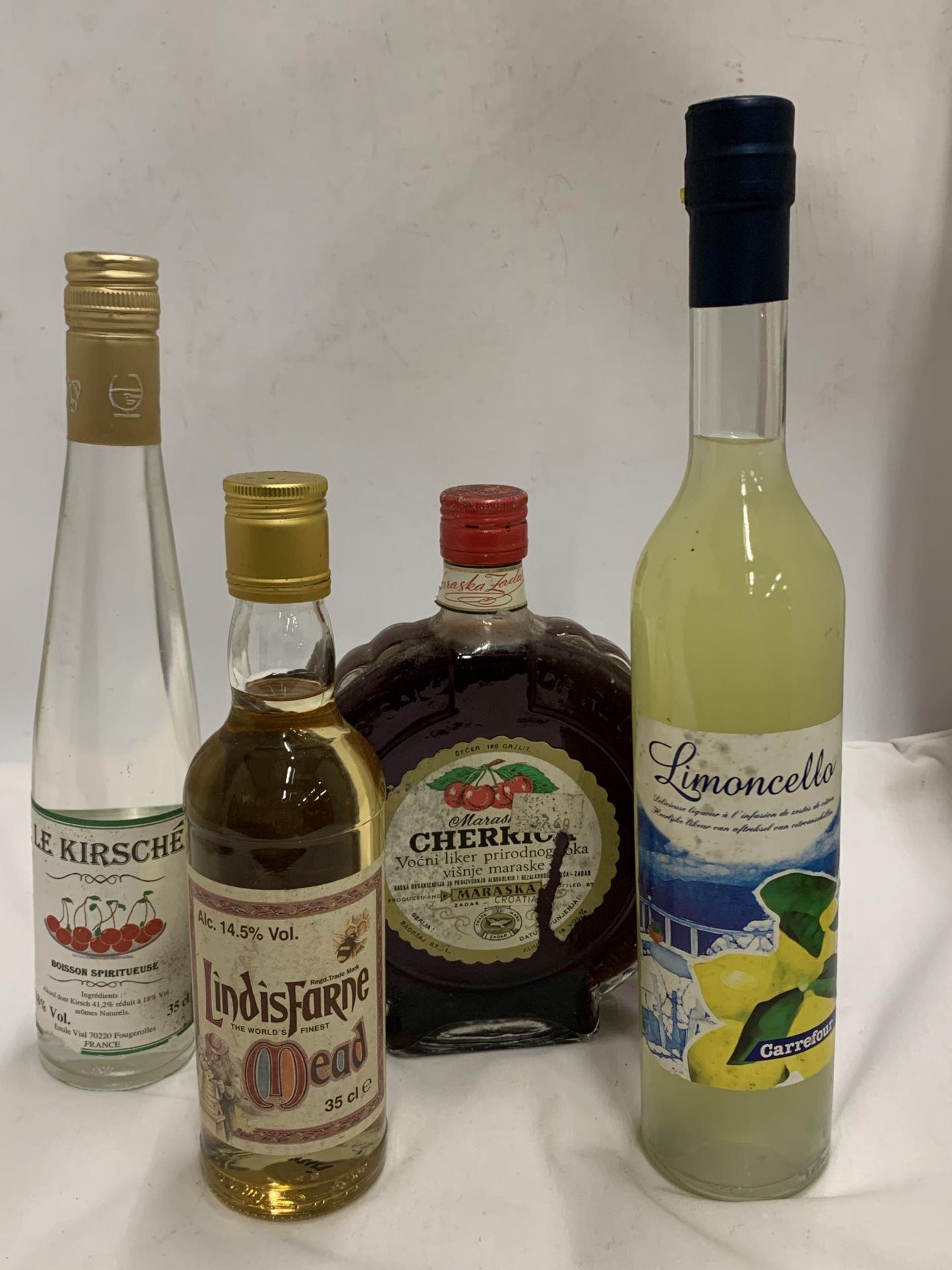 FOUR MIXED BOTTLES - LINDIS FARNE 35CL MEAD, LE KIRSCHE, MARASKA CHERRICA AND LIMONCELLO