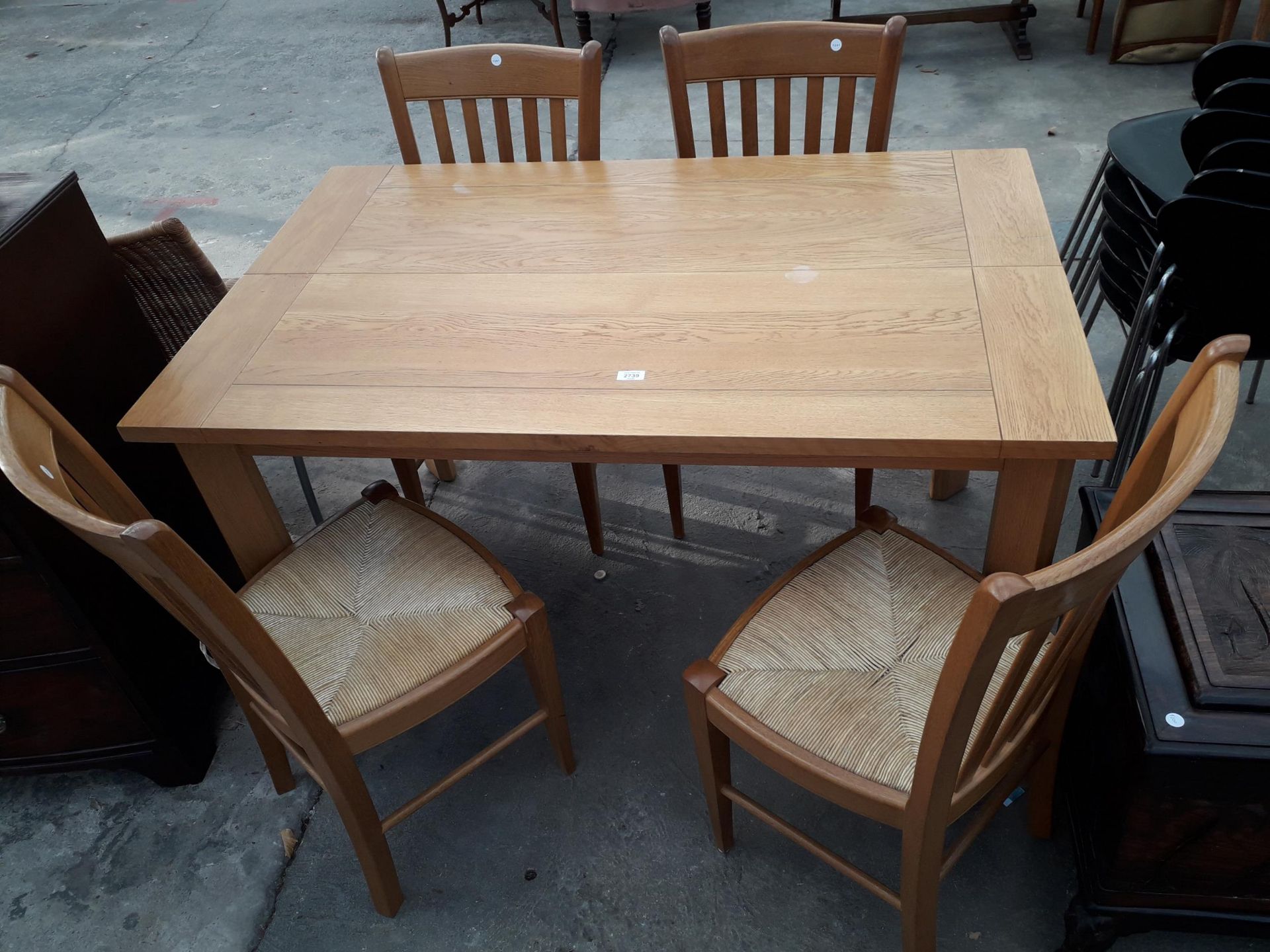 A MODERN OAK EXTENDING DINING TABLE, 52 X 32" (LEAF 19") AND FOUR RUSH SEATED CHAIRS - Image 2 of 3