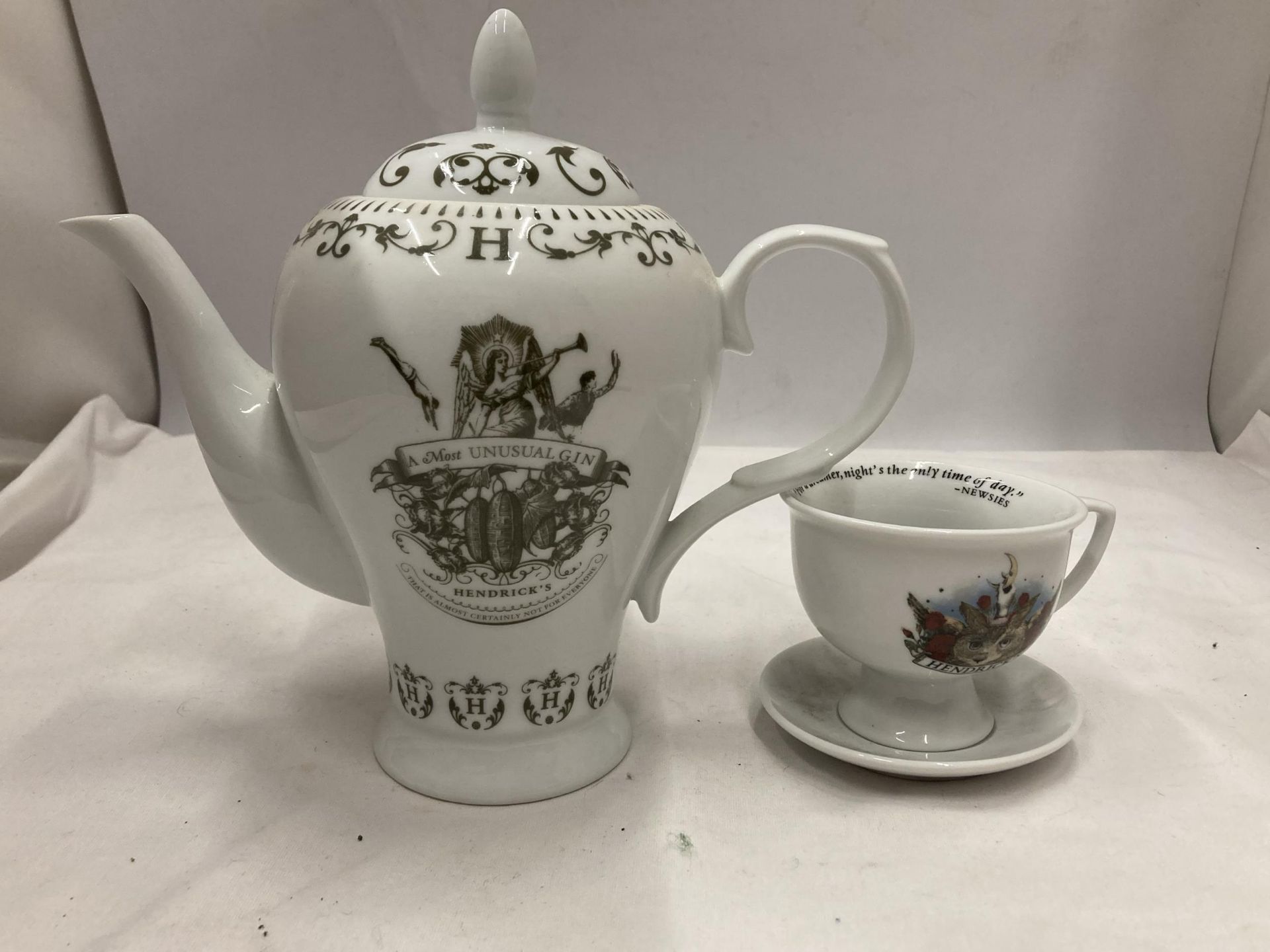 A HENDRICKS TEAPOT AND CUP AND SAUCER