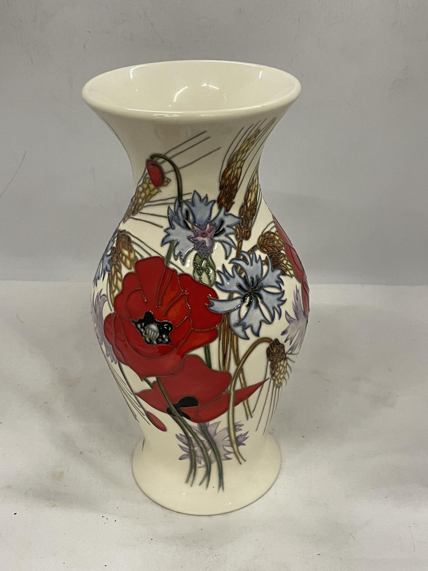 A LARGE MOORCROFT POPPY TRIAL VASE HEIGHT 12"