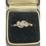 AN 18 CARAT GOLD RING WITH THREE DIAMONDS SIZE M GROSS WEIGHT 2.66 GRAMS WITH PRESENTATION BOX