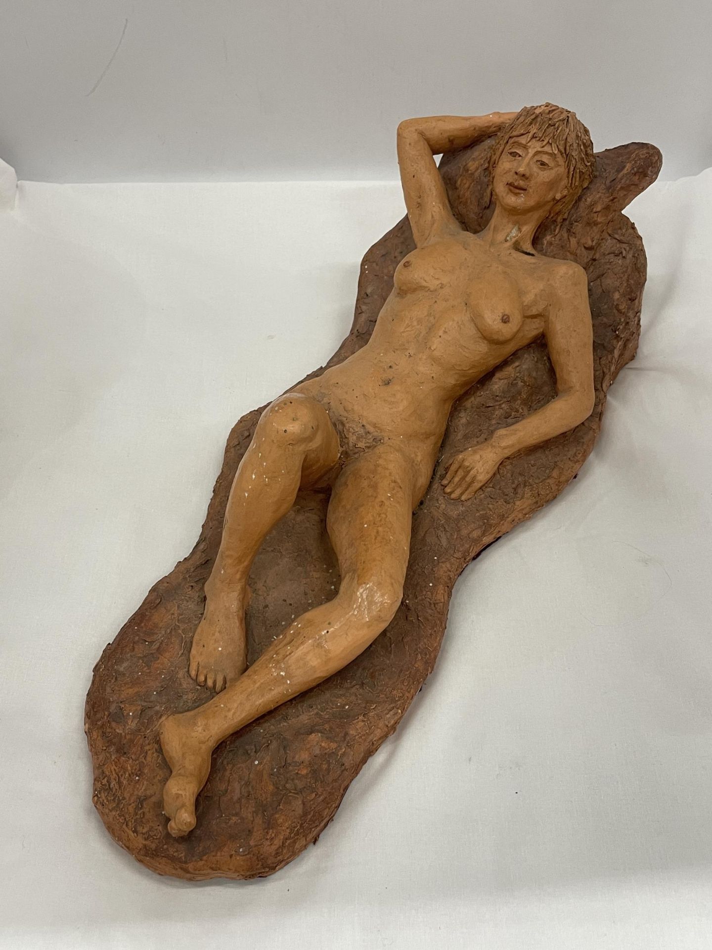 A STUDIO POTTERY SCULPTURE OF A NAKED LADY