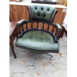 A GREEN SWIVEL CAPTAINS DESK CHAIR