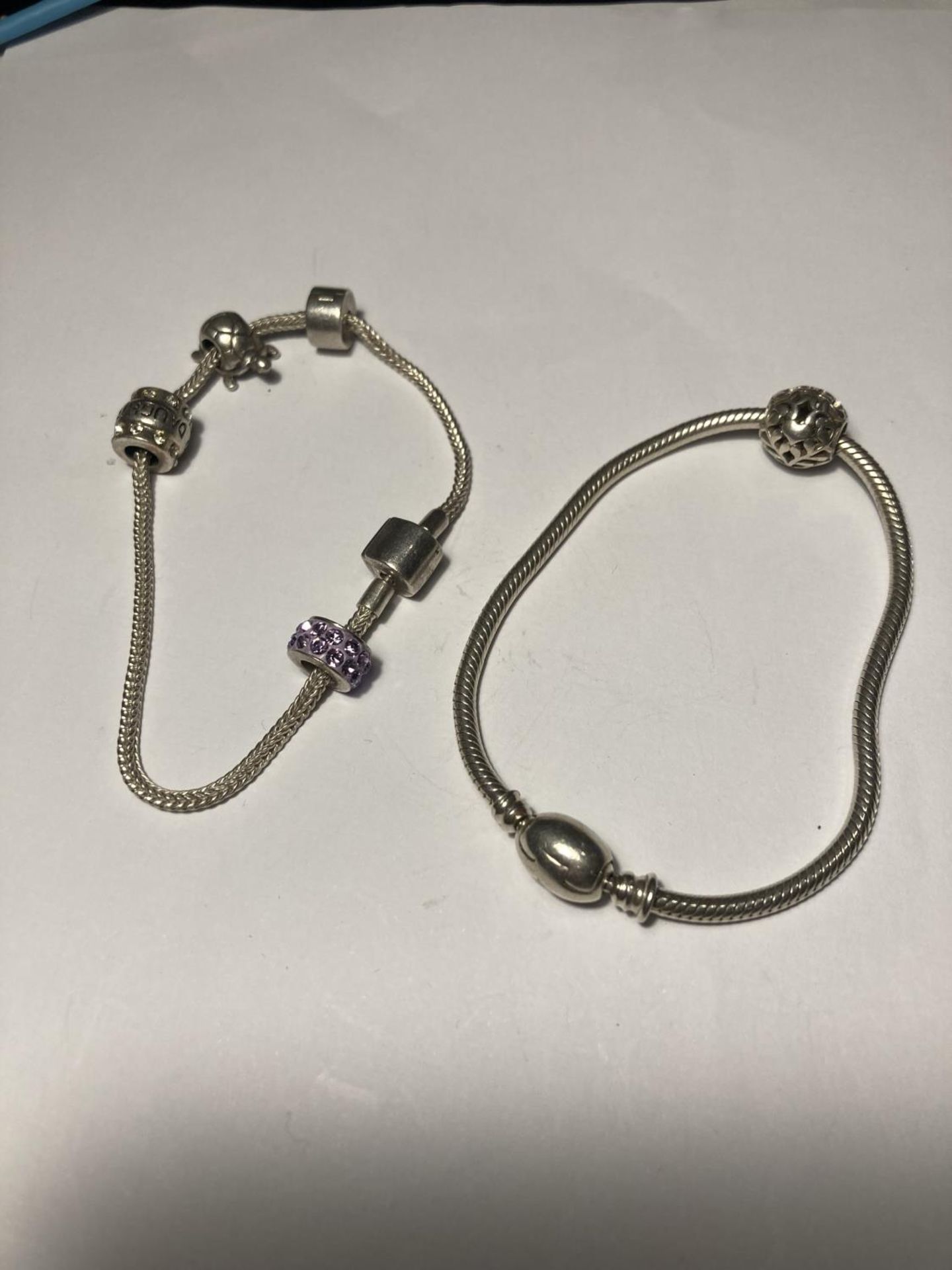 TWO SILVER PANDORA STYLE BRACELETS