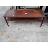 A RETRO TEAK TWO TIER COFFEE TABLE ON TURNED TAPERING LEGS, 42 X 16"