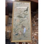 A LARGE FRAMED ORIENTAL STYLE NEEDLEWORK ON SILK PICTURE OF A LAKE SCENE WITH DUCKS, BIRDS AND FLORA