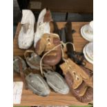 A COLLECTION OF VINTAGE SPORTING EQUIPMENT TO INCLUDE BOXING GLOVES, ROLLER SKATES, ICE SKATES AND