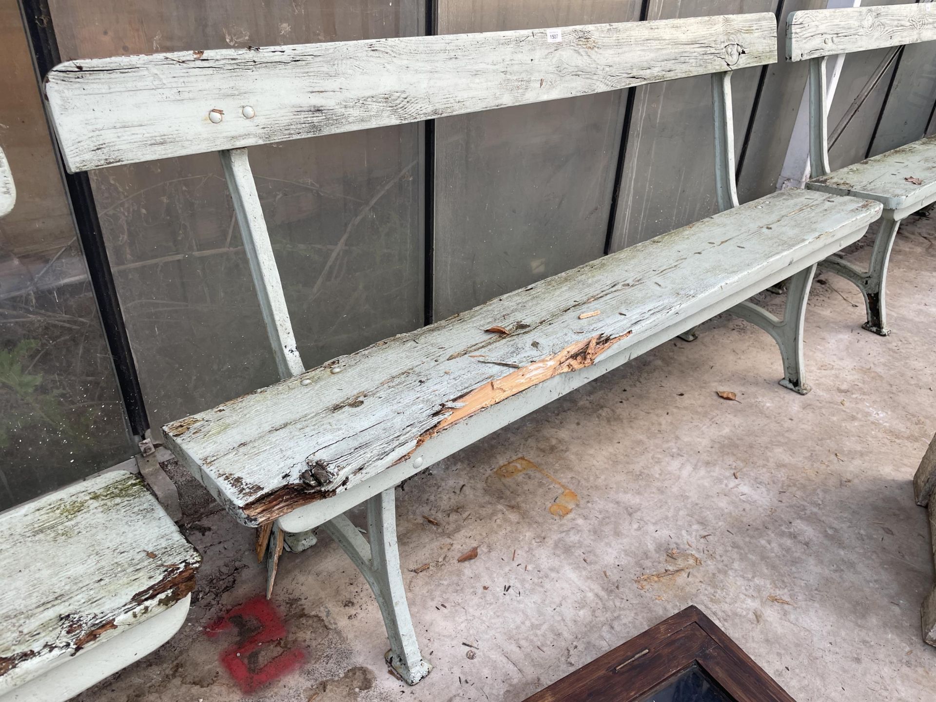 A VINTAGE WOODEN RAILWAY BENCH WITH CAST BENCH ENDS (L:167CM)