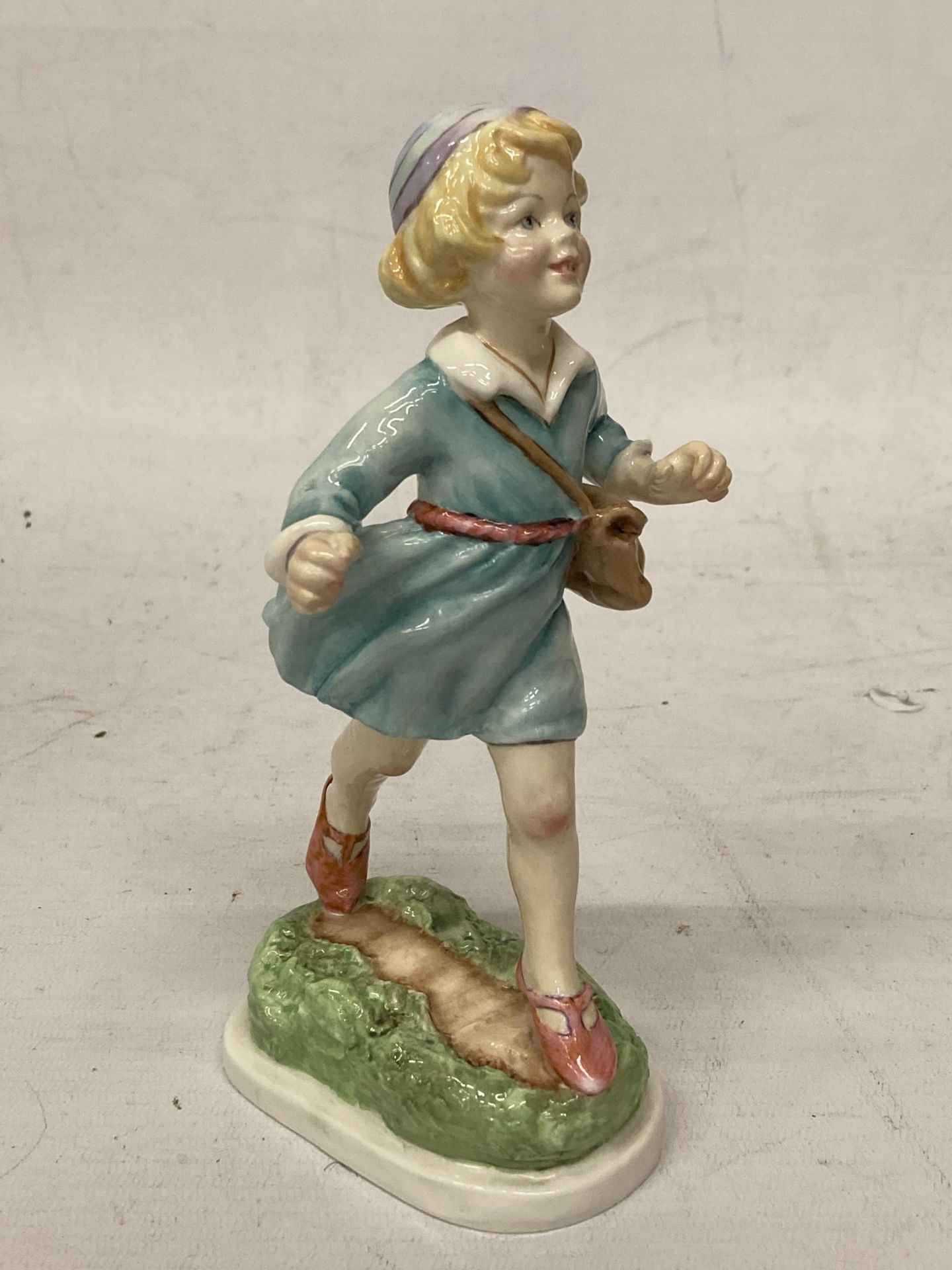 A ROYAL WORCESTER FIGURE "THURSDAY'S CHILD HAS FAR TO GO" 3522