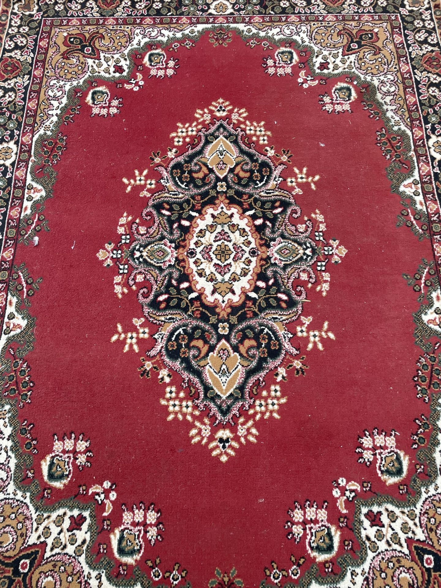 A RED PATTERNED RUG - Image 2 of 2